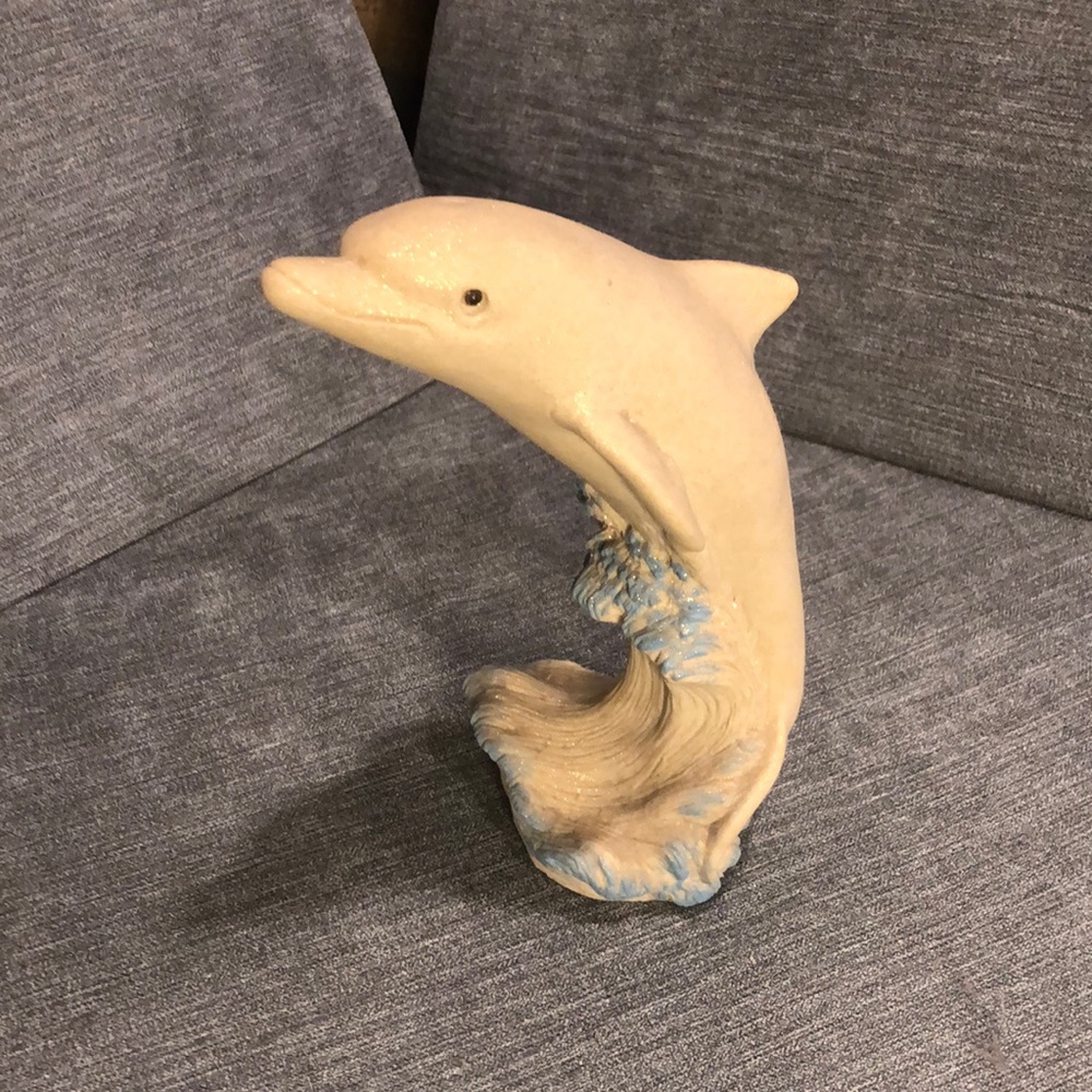 Dolphin sand sculpture